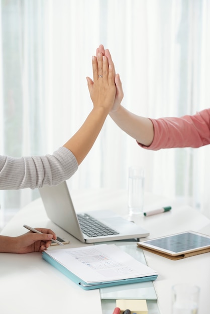 Free photo crop colleagues giving high five