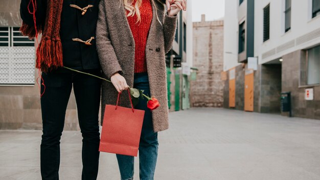 Crop couple walking on date