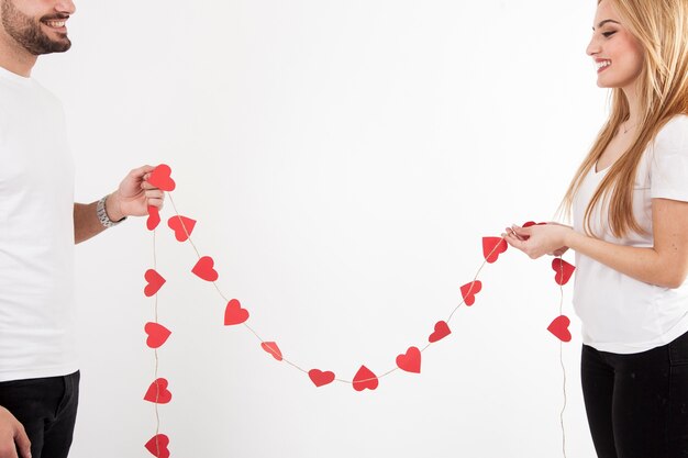 Crop couple with heart garland