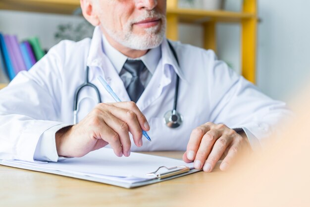 Crop doctor listening to patient