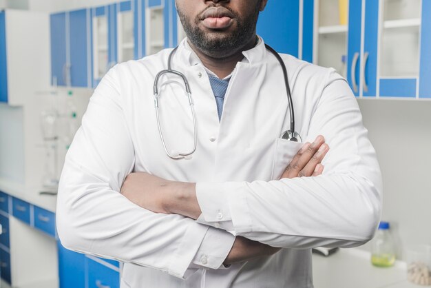 Crop ethnic medic with arms crossed