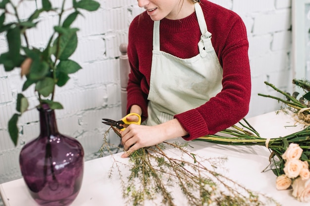 Free photo crop florist cutting twigs