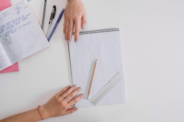 Crop girls posing with notepad