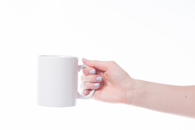 Crop hand holding mug