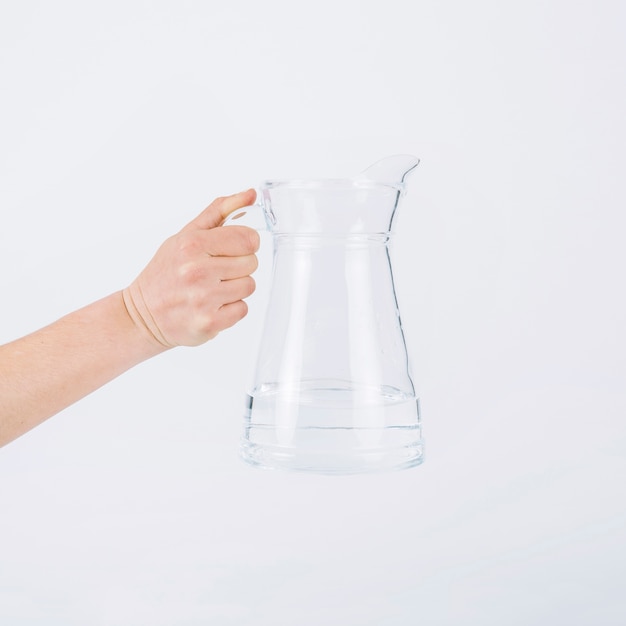 Crop hand holding water jug