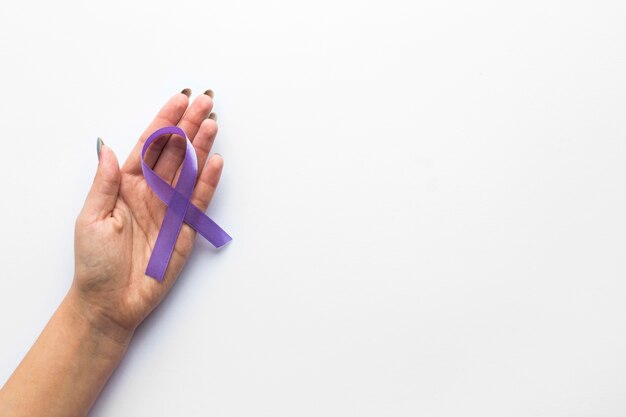 Crop hand with lymphoma ribbon