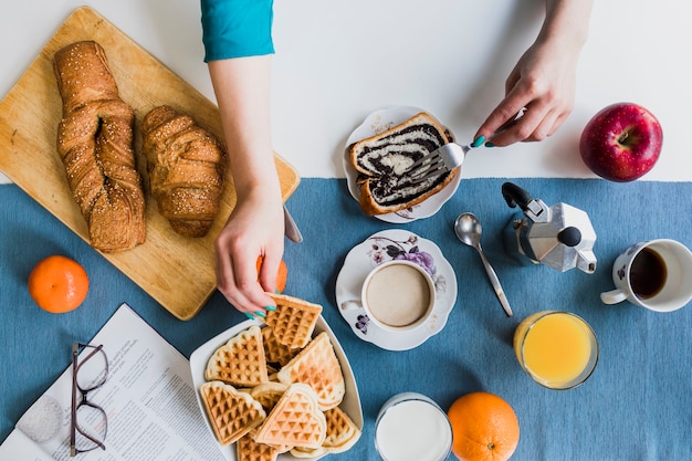 Crop hands during breakfast