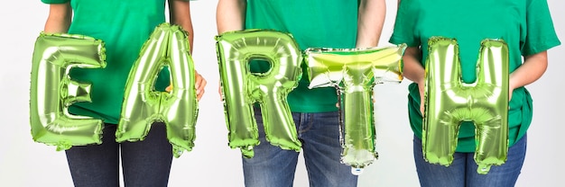 Crop hands of people holding letters