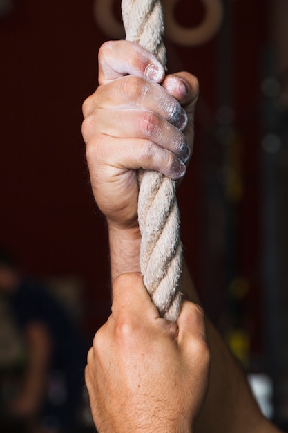 Free photo crop hands on rope