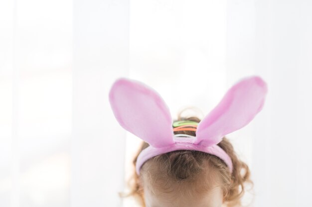 Crop kid with bunny ears