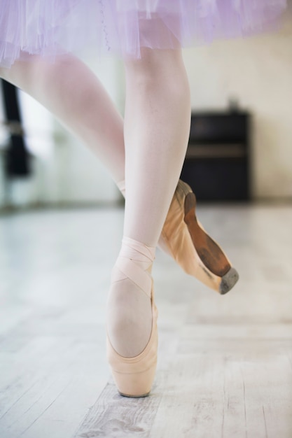 Crop legs of ballet dancer