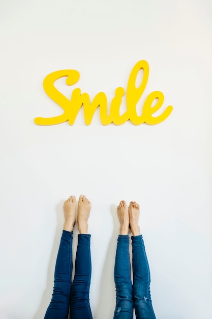 Free photo crop legs and colorful word smile