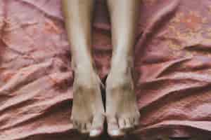 Free photo crop legs on thin blanket