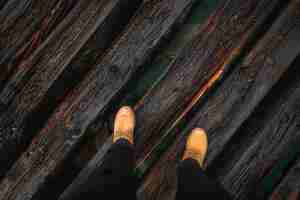 Free photo crop legs on wooden bridge