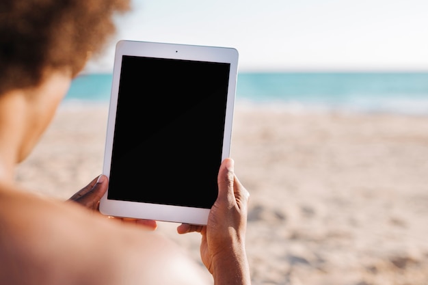 Crop male hands holding tablet