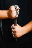 Free photo crop man holding dagger