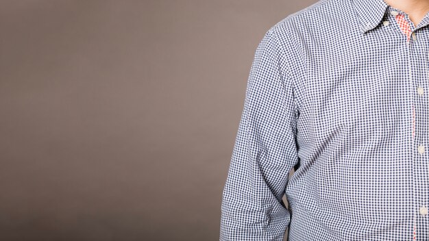 Crop man standing in studio