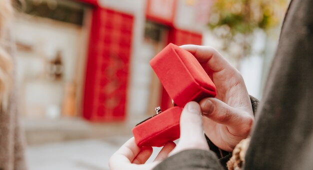 Crop man with ring in box