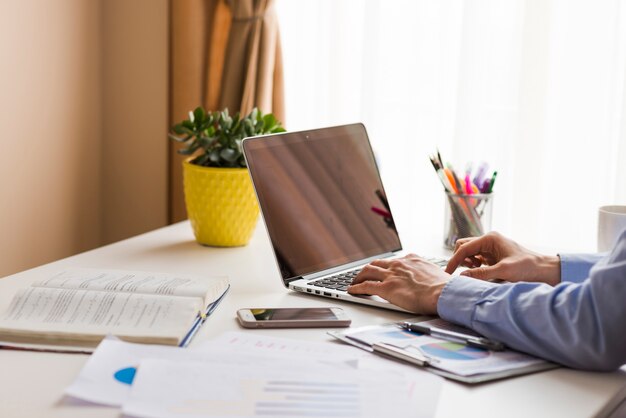 Crop man working in office