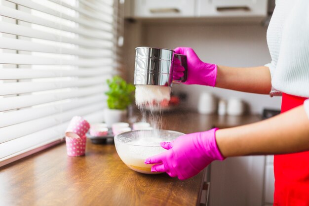 Crop person bolting flour