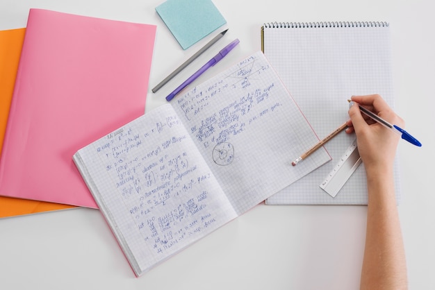 Free photo crop schoolgirl doing homework