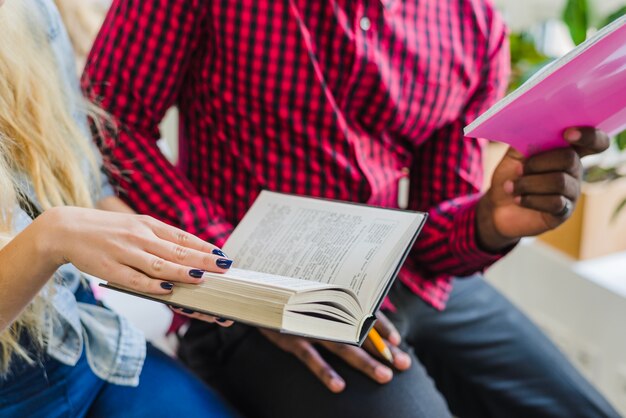 Crop students with books