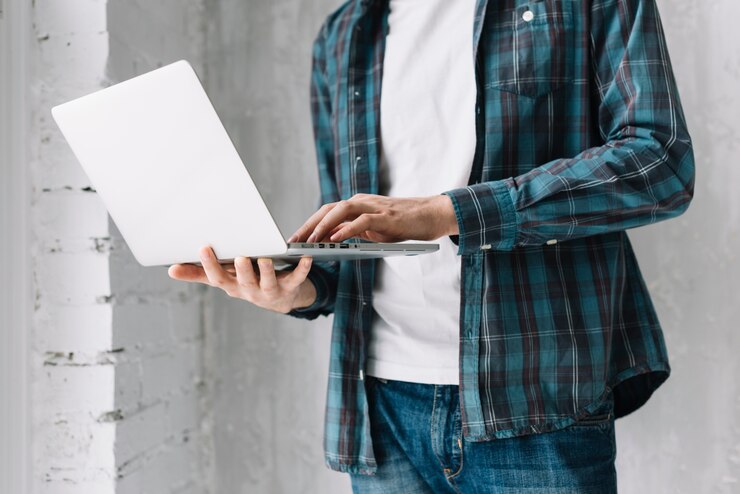 Free Photo crop stylish man using laptop
