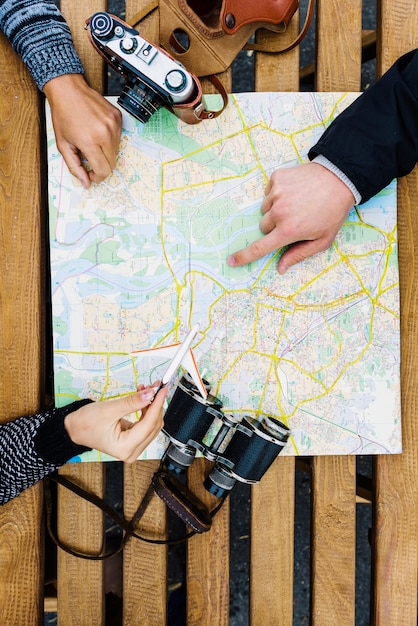 Crop tourists with map