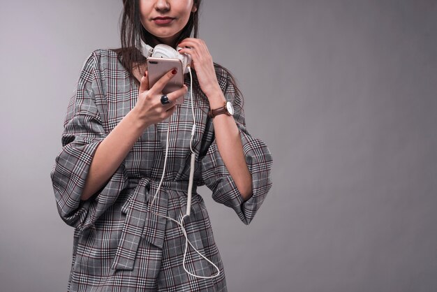 Crop woman choosing music