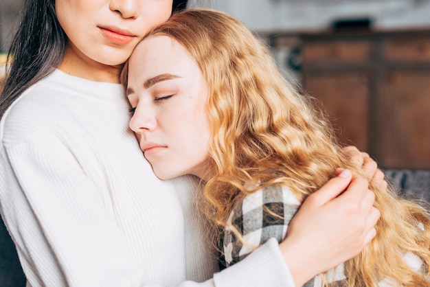 Free photo crop woman comforting friend