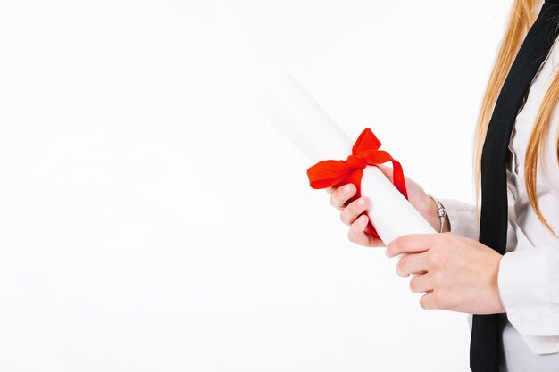 Crop woman holding diploma