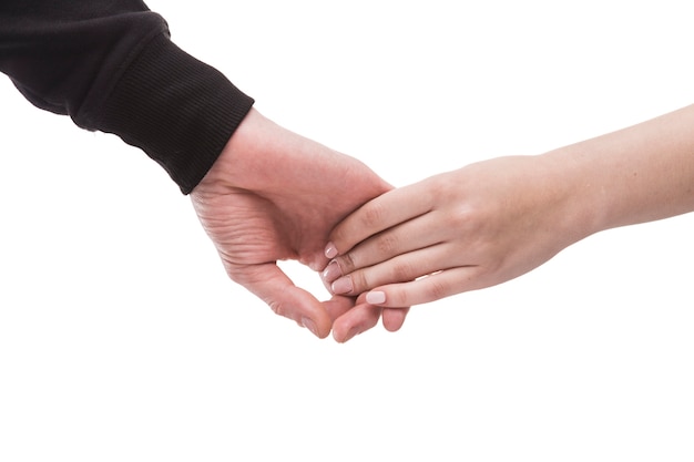 Crop woman holding hand of man