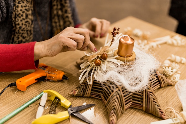 Free photo crop woman making decoration