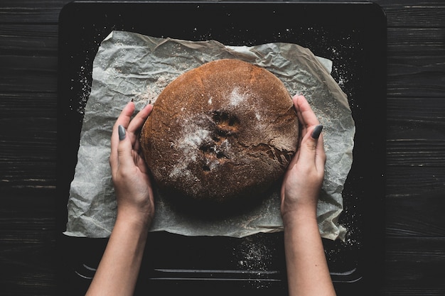 Free photo crop woman making healthy bread