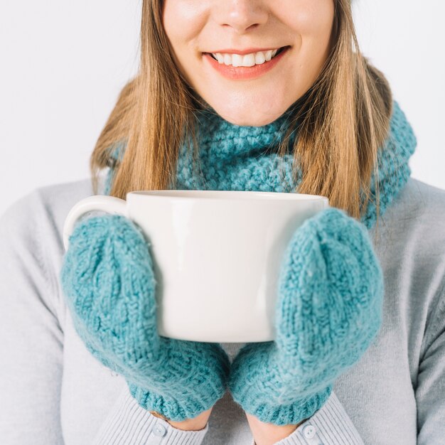 Crop woman with hot drink