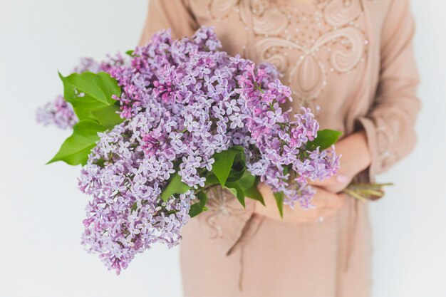 Crop woman with lilac