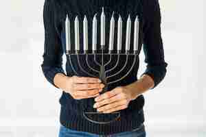 Free photo crop woman with menorah