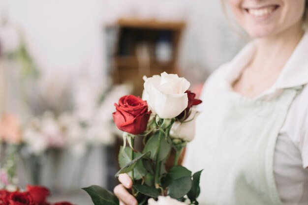 Crop woman with roses