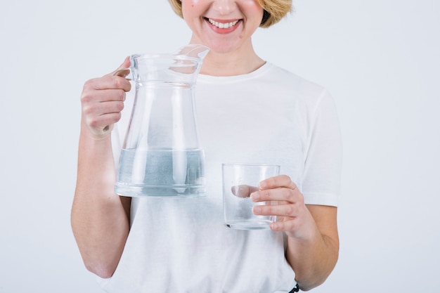 Crop woman with water on white background