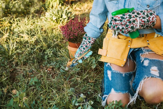 Crop woman working in garden