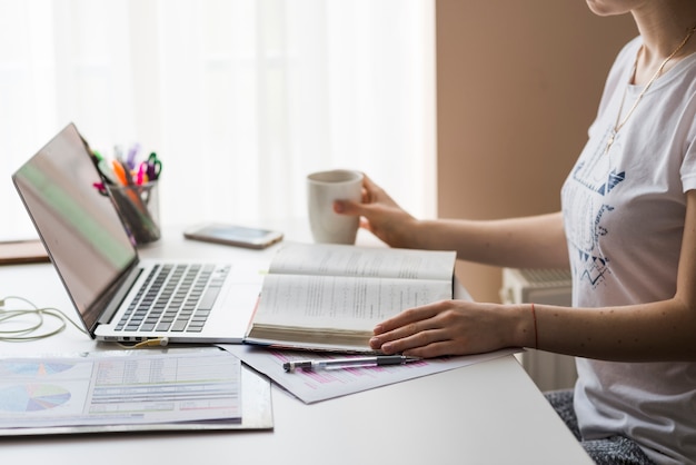 Crop woman working in office