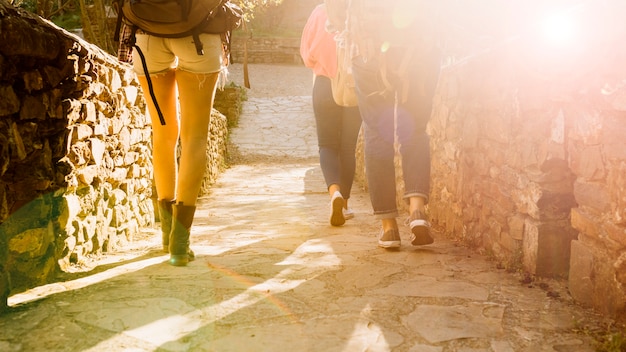 Crop women with backpacks 