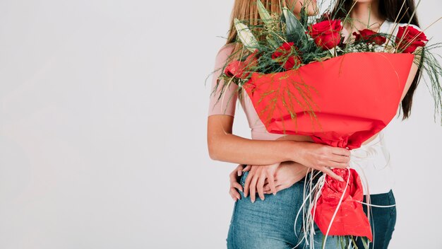 Crop women with flowers