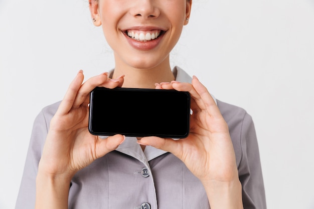 Cropped image of a cheerful young housemaid