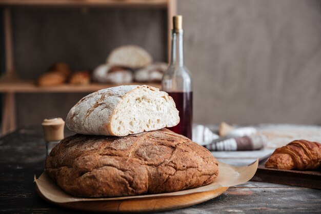 Cropped image of a lot of bread on table