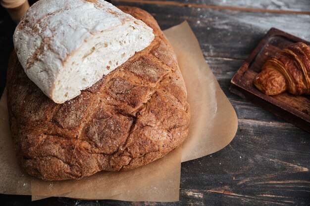 Cropped image of a lot of bread on table