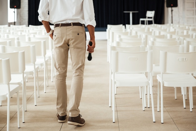 Cropped image of young african man standing in office