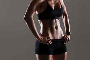 Free photo cropped photo of amazing young sports woman body