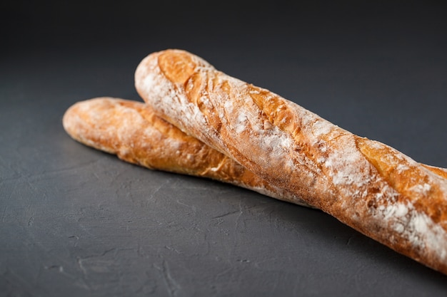 Cropped photo of two french baguettes