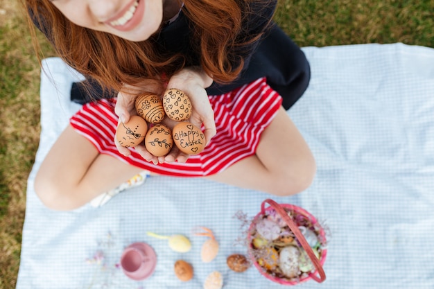 Free photo cropped portrait of young smiling woman